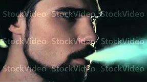 young handsome bearded hipster man smoking cigarette