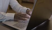 Free stock video - Close up of american male hands typing on laptop keyboard at workplace