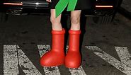 What’s With Those Cartoonishly Big Red Rubber Boots Influencers Are Showing Off On Social Media?