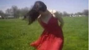 Open Field Wind Blowing Woman's Dress and Hair Around