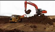 Hitachi EX350 excavator loading trucks