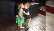 Adorable First Kiss Between Cute Baby Girl and Baby Boy