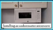 Mounting an under cabinet microwave