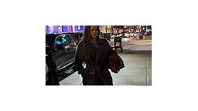Rihanna is oh so chic as she bundles up in a long black coat