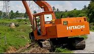EXCAVATOR LONG ARM HITACHI UH045 5 CLEARING AND SLOPING A SMALL RIVER