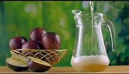 Still shot of pouring homemade apple juice into a glass jug or... | Indian Stock Footage | Knot9