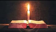 Bible Reading By Candlelight Closeup On Desk Moving Wall 4K Christian Worship Background Motion Loop