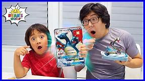 Ryan and Daddy opening Giant Size Pokemon Cards!!!