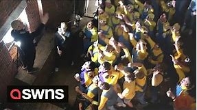 Over 70 people dress as ‘Minions’ and cheer the arrival of leader 'Gru’ at Halloween party | SWNS