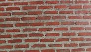 walls of the house are built with red bricks in a vintage style. It is a beautiful and strong design for living in. It was designed with classic engineers and skilled craftsmen.