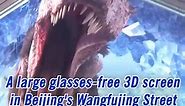 A large glasses-free 3D screen is unveiled in Beijing's Wangfujin Street