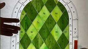 Medieval Stained Glass Window with a Diamond Grid and Charming Round Top
