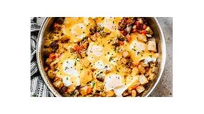 This Easy Breakfast Skillet is loaded with the good stuff including potatoes, eggs, bacon and sausage topped with shredded cheese and baked to perfection.