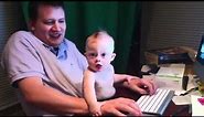 Cute Baby Born With Down syndrome Playing on the computer. Down syndrome videos