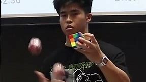 Fastest time to solve a cube whilst juggling - 13.03 seconds by Daryl Tan Hong An 🇸🇬