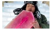 Eating a popsicle in an igloo