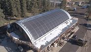 Curved solar PV array on a farm quonset in Brazeau County, Alberta