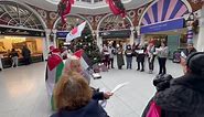 Activists decorated Christmas tree in High Street Kensington with Palestinian flags and sang ceasefire carols