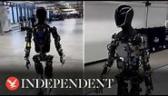 Elon Musk takes 'spooky' humanoid robot out for walk round factory