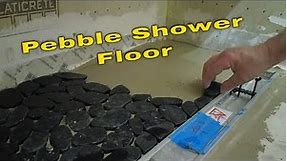 Black pebble tile shower floor Install