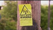 5G cell tower critics post 'health warning' signs
