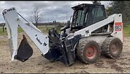 Bobcat 863 with a Bobcat 709 Backhoe Attachment | Belted Galloway Homestead
