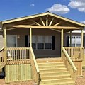 A Frame Mobile Home with a Flat Roof Porch