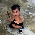 Kid with Cross Looking Scared Meme