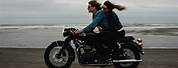 Couple Riding a Motorcycle On a Long Road