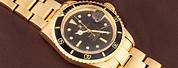 Gold Rolex Submariner Watch