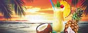Pineapple and Pina Colada On Beach Background