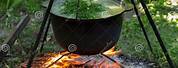 Serving Soup From a Cauldron Over a Fire