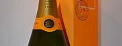 Silver Champagne Bottle Orange Label