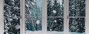 Snow Falling Outside Window