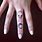 Alien Finger Tattoo