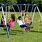 Children Playing On Swings