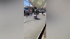 Bungling motorcyclist rides through freshly laid cement
