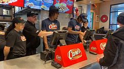 UConn players serve up fried chicken at Raising Cane's in Enfield