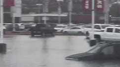 Flash flooding submerges roads and cars in Beaumont, Texas