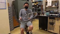 Angular Momentum Conservation with A Spinning Wheel