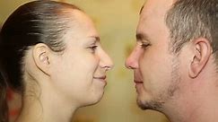 man and woman kiss passionately, close-up