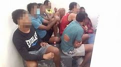 Men detained in a crowded cell for not wearing face masks amid Fiji's worsening COVID-19 outbreak