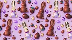 Set of adorable chocolate Easter bunnies and eggs. Loopable animation of cute and delicious sweets on a pastel background. Traditional candies while spring celebration. Happy Easter. Joy. Gift. Fun.
