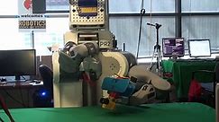 BRETT the Robot assembles toy airplane part