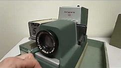 Argus 300 slide projector, 1958, w/ bulb, metal cartridge, original cartridge box, & case! WORKING.