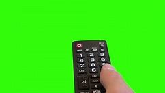 Television Remote Changing Channels On Green Screen. Hand using a remote control over a green screen background
