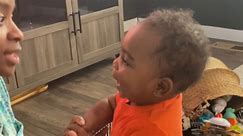 Adorable baby boy pretends to shout for the Lord to reciprocate