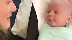 'Cutest thing ever!' - Swaddled-up newborn baby boy tries 'so hard' to talk to his mom