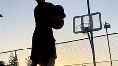 Guy Balancing Himself on Balance Board Makes Basketball Trickshots