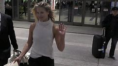 Back to reality! Ali Larter returns from Mexico getaway